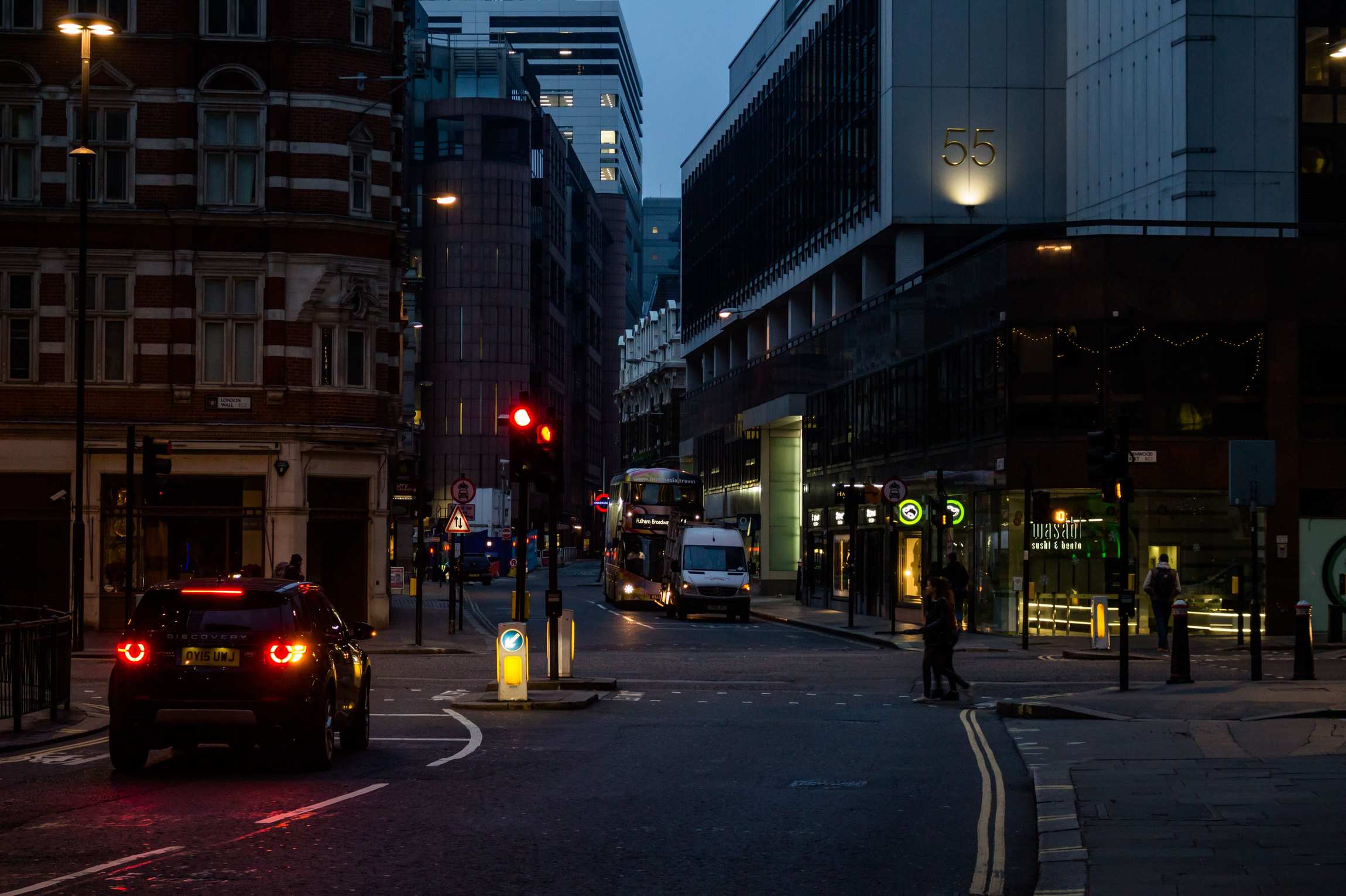 City street with buildings in evening light, urban downtown evening
