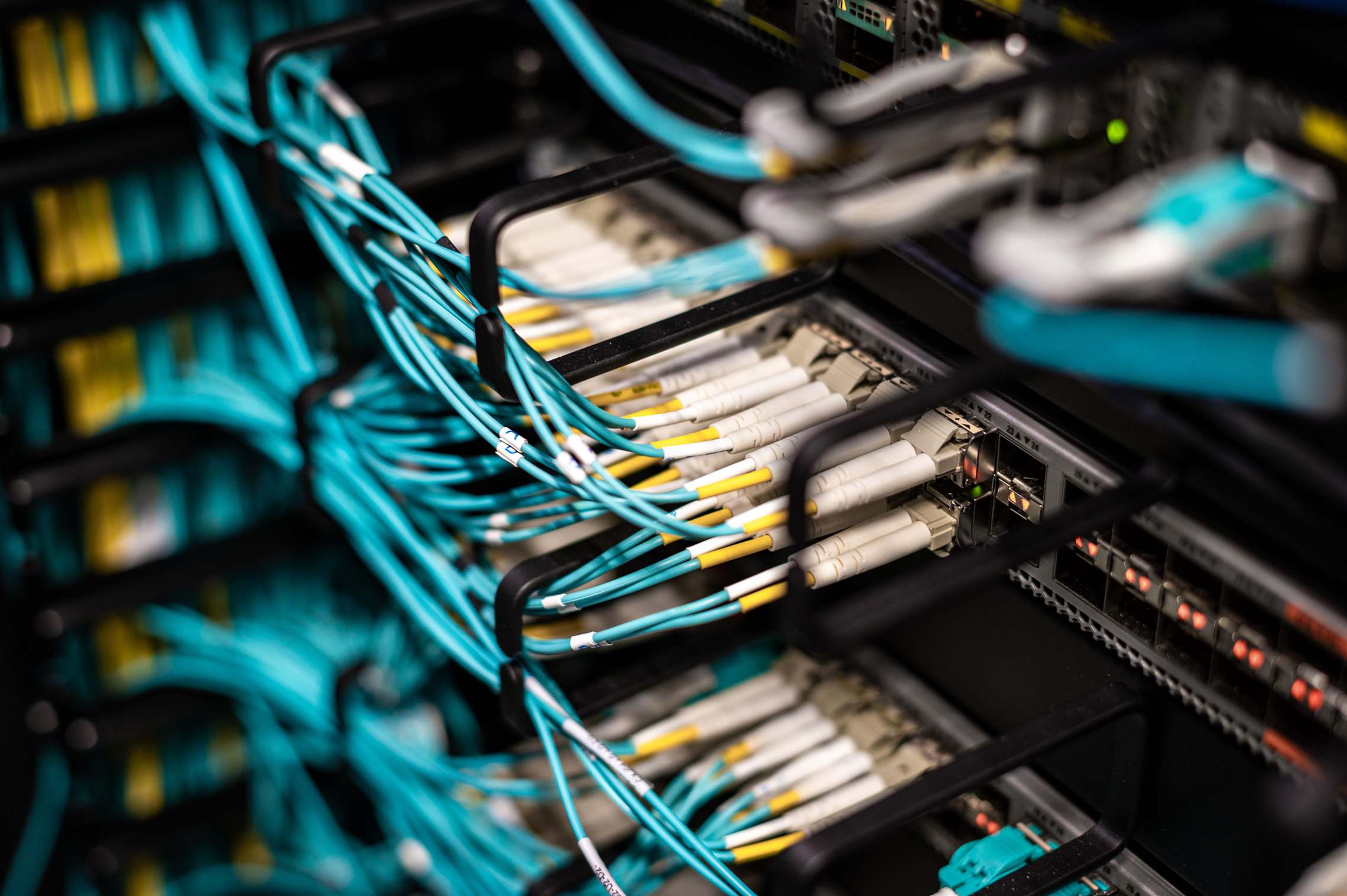 Server room with illuminated equipment racks at night, datacenter dashboard ethernet